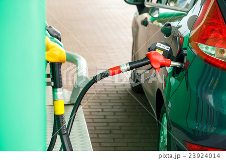 Car refueling on a petrol station 23924014