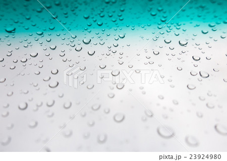 Water drops background. Water drops on glass window over blue sky 23924980