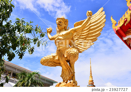 A statue of a golden Garuda 23927727