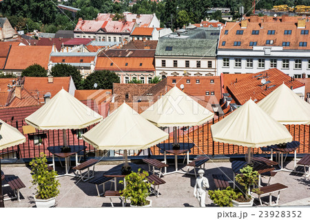 Empty tables, chairs and umbrellas in restaurant Empty tables, chairs and umbrellas in restaurant 23928352