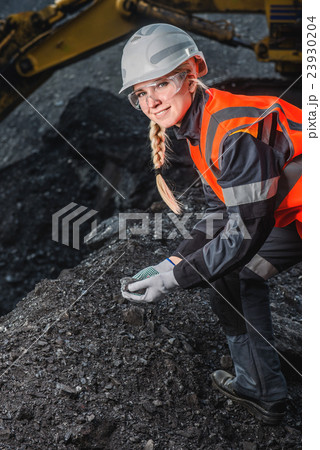 Worker with coal in the hands 23930204