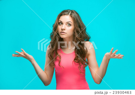 Portrait of young woman with shocked facial 23930463