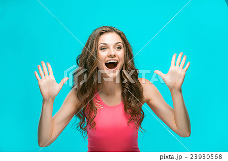 The young woman's portrait with happy emotions The young woman's portrait with happy emotions 23930568