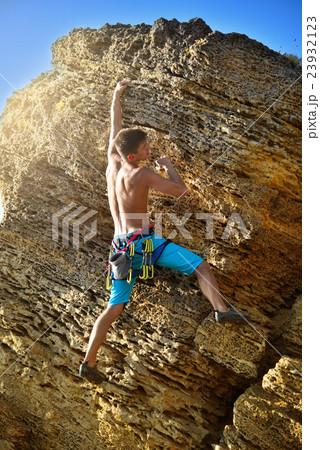 Male climber in mountains. 23932123