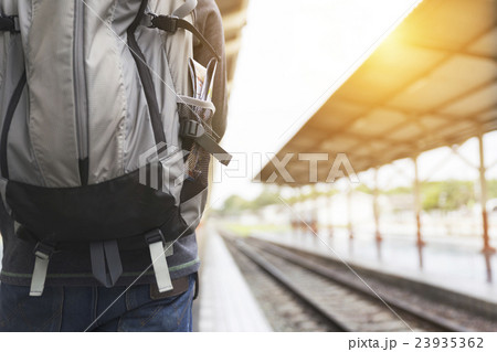 man with backpack at train station 23935362