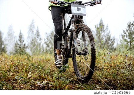 dirty feet of mountainbiker and Bicycle wheel dirty feet of mountainbiker and Bicycle wheel 23935665