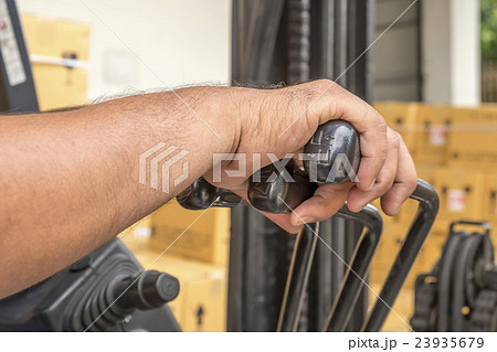 hand touching steering wheel control and Cabin for 23935679