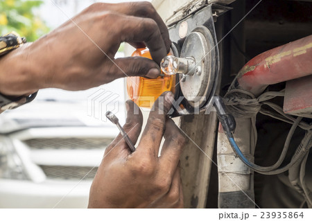 Hands of car mechanic in auto repair service,car 23935864