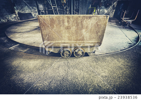 Retro toned old rusty mine cart. Retro toned old rusty mine cart. 23938536