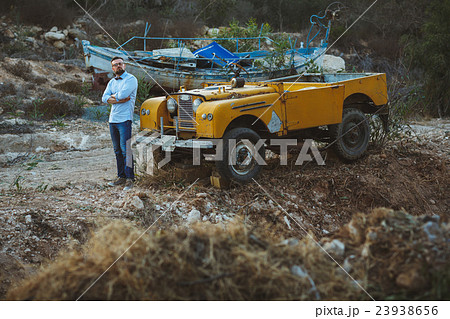 Young stylish man with glasses and bow tie near the old-fashione 23938656