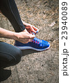 Running shoes. Closeup of woman tying shoe laces 23940089