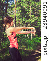 Young fitness woman runner stretching before run 23940091