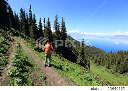 backpacker hiking on beautiful mountain peak trail backpacker hiking on beautiful mountain peak trail 23940865