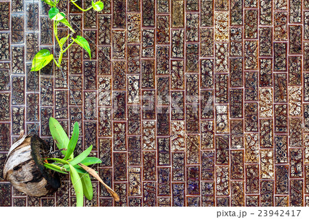 tile background with green leaf decoration tile background with green leaf decoration 23942417