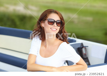 Attractive girl sailing on a yacht on summer day 23952621