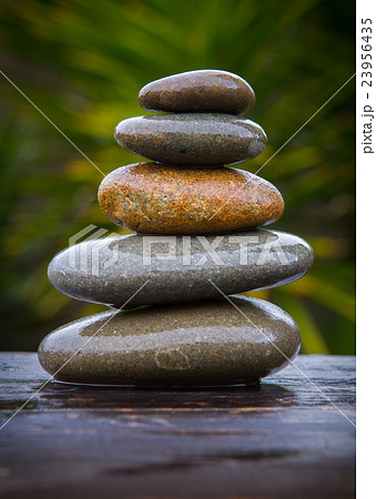 stack of round smooth wet pebbles stack of round smooth wet pebbles 23956435