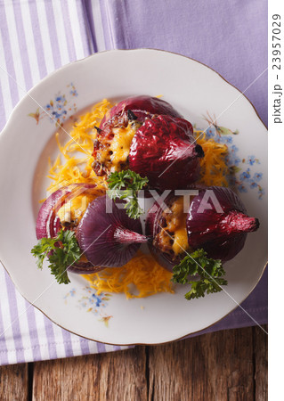 Tasty baked red onion with meat and cheddar Tasty baked red onion with meat and cheddar 23957029