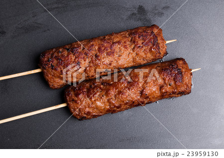 lula kebab on wooden skewers dark baking 23959130
