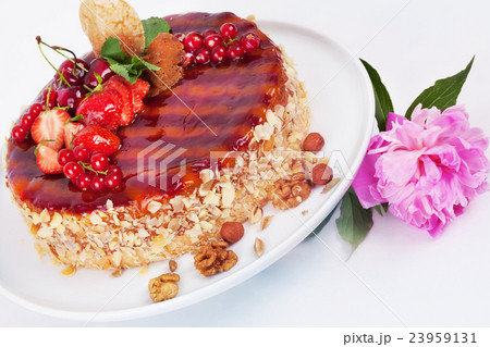cake with strawberries currants cherries and nuts 23959131