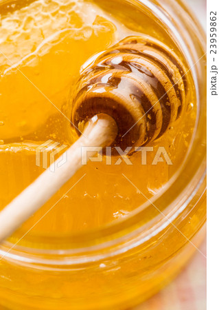 Wooden honey stick. Wooden honey stick. 23959862