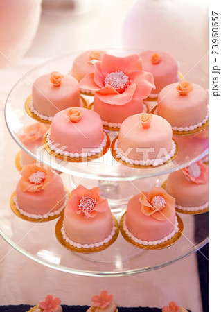 pink cupcakes on a glass stand  23960657