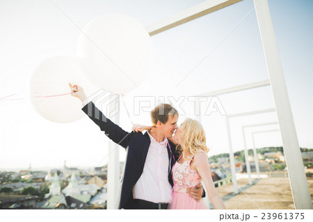 Pretty sunny outdoor portrait of young stylish 23961375
