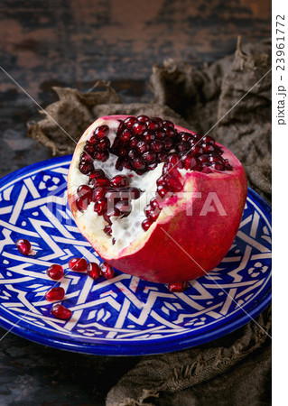 Sliced ripe pomegranate Sliced ripe pomegranate 23961772