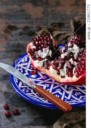 Sliced ripe pomegranate Sliced ripe pomegranate 23961773