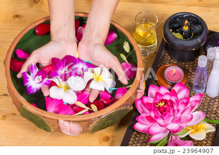 Closeup photo of a female hands at spa salon Closeup photo of a female hands at spa salon 23964907