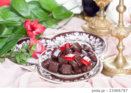 red jelly in chocolate on a plate luxury  23966787