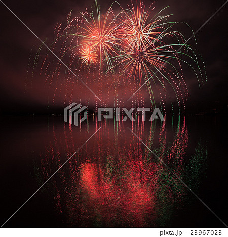 Colorful fireworks with reflection on lake. 23967023
