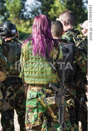 mens in military uniform with weapon 23968481