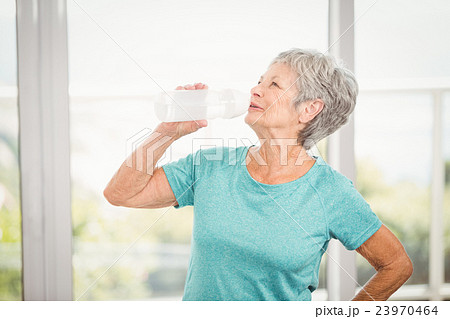 Senior woman drinking water Senior woman drinking water 23970464