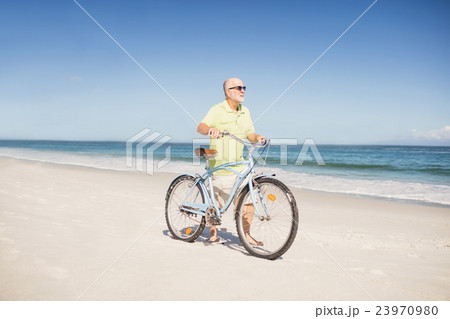 Smiling senior man with bike 23970980