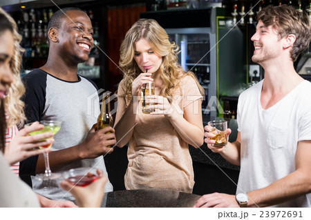 Group of friends having a drink Group of friends having a drink 23972691