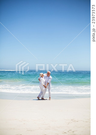 Senior couple dancing at the beach 23973573