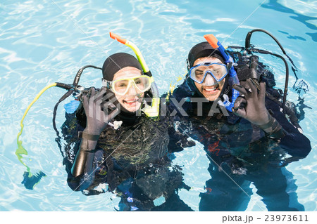 Couple practicing scuba diving together 23973611