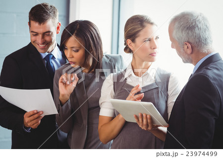 Businesspeople working in office Businesspeople working in office 23974499