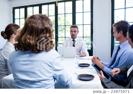 Businessman talking in a business meeting 23975071
