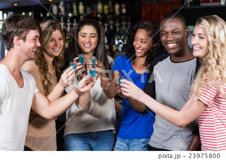 Group of friends having shots 23975800