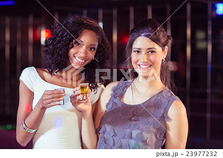 Pretty girls having shots 23977232