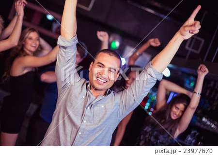 Cute friends having fun and dancing 23977670