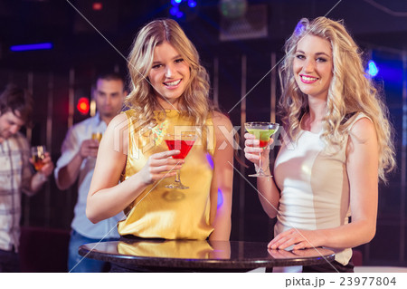Pretty girls with cocktails Pretty girls with cocktails 23977804