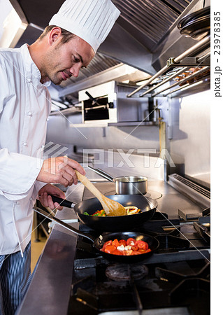 Chef preparing food in the kitchen 23978385