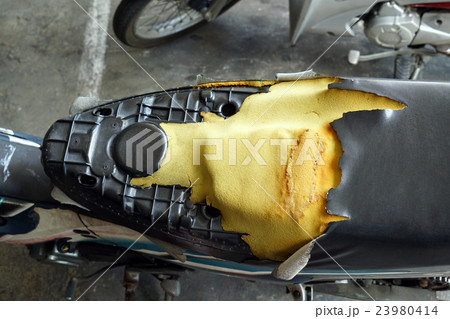 old motorcycle seats waiting for repair 23980414