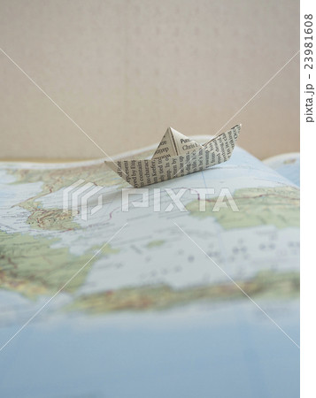 Paper boat on map book Paper boat on map book 23981608