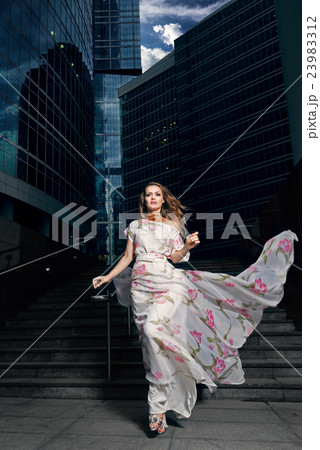 Elegant woman in long dress Elegant woman in long dress 23983312
