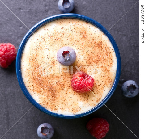 Top view on creamy dessert with cinnamon Top view on creamy dessert with cinnamon 23987360