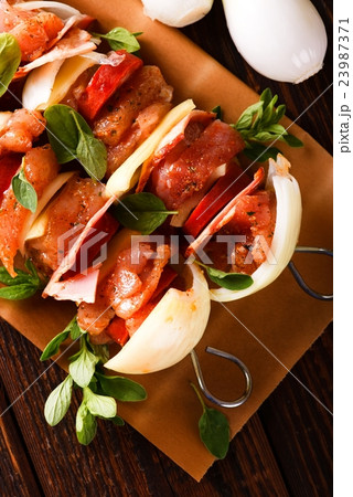 Top view on two skewers with meat Top view on two skewers with meat 23987371