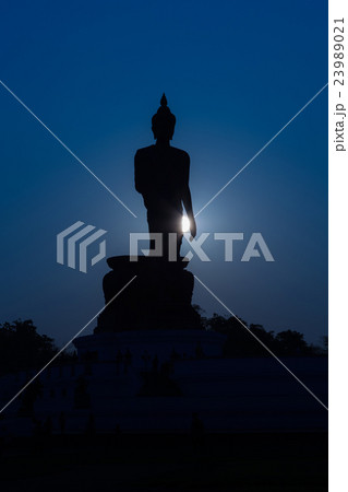 Silhouette Buddha night lights background Silhouette Buddha night lights background 23989021